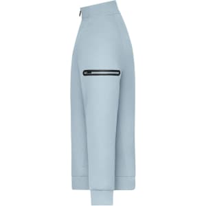 A zip jacket in light blue with a side zip pocket and ribbed cuffs, featuring a logo on the material.
