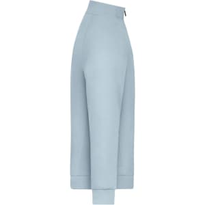 A light blue zip jacket with a fitted design and ribbed cuffs. The jacket has a logo on it.