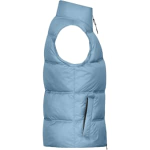 A blue ladies winter vest with a zippered pocket and high collar, featuring a puffy design.