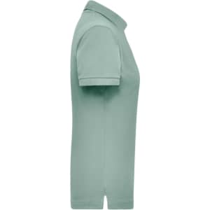 A light green women's polo shirt with a classic collar and short sleeves, featuring a logo.