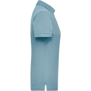 A light blue women's polo shirt with a short sleeve and a collar, featuring a logo on the chest.