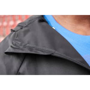 A black men's running jacket with a close-up view of the collar, paired with a blue shirt underneath.