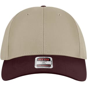 A 6 panel low profile baseball cap in beige with a burgundy peak, featuring a logo on the front.