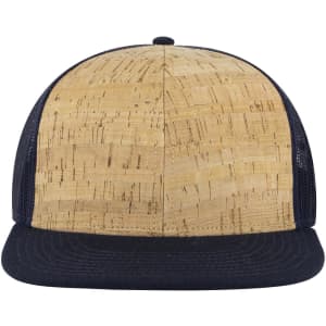 A six-panel mid-profile trucker cap featuring a cork-patterned front and a navy mesh back.