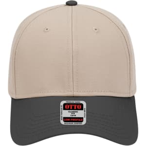 A six-panel low profile baseball cap featuring a beige upper and black visor, with a logo on the front.