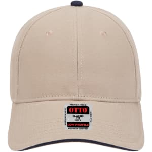 A beige 6 panel low profile baseball cap featuring a dark navy undervisor and a branded label.
