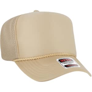 A high crown beige trucker hat with a mesh back and a decorative trim, featuring a logo on the front.