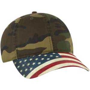 A camouflage baseball cap with a low profile and an American flag design on the visor. Features a logo.