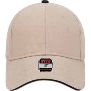 A low profile baseball cap in beige with a black brim and a logo on the front.