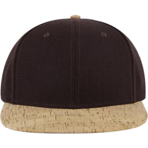 A snapback cap featuring a black upper and a cork-patterned brim, with a slightly elevated profile and a logo.