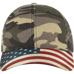A camouflage baseball cap with a low profile and an American flag design on the brim. Features a logo on the front.