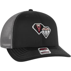 A black mid-profile trucker cap with a grey mesh back and a decorative logo on the front.