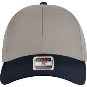 A low profile baseball cap in beige with a navy blue brim, featuring a brand logo on the front.