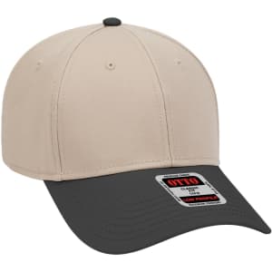 A beige and charcoal low profile baseball cap featuring a logo on the side and six panels.