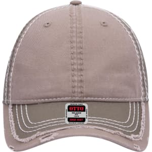 A beige six-panel low profile dad cap with a curved brim and a logo patch on the front.