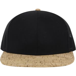 A black and cork 6 panel mid profile trucker cap featuring a rounded peak and mesh sides.