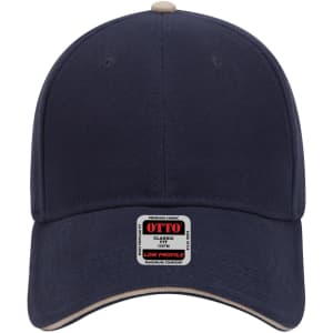 A navy blue 6 panel low profile baseball cap with a cream-coloured brim and a logo on the front.