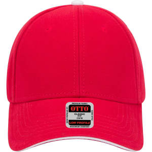 A red 6-panel low profile baseball cap featuring a branded tag. The cap has a smooth fabric finish.