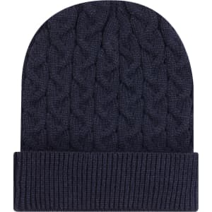 A navy blue cable knit beanie with a rib knit cuff, featuring a logo.