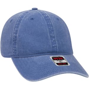 A blue 6 panel low profile dad cap with a branded tag, featuring a soft, faded texture.