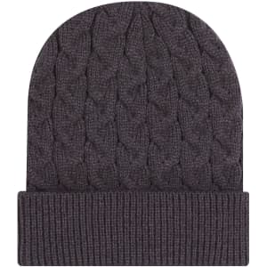 A dark grey cable knit beanie with a rib knit cuff and a logo present on the fabric.