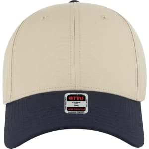 A beige and navy 6 panel low profile baseball cap featuring a logo on the front.