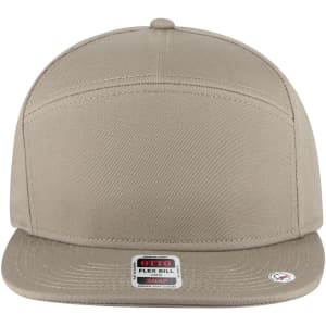 A beige 7 panel mid profile snapback cap with a flat brim and a logo on the side.