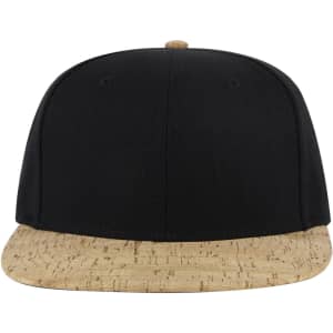 A snapback cap featuring a black top and a textured beige cork peak, with a logo on the front.
