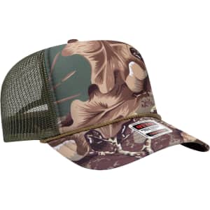A five-panel high crown trucker cap in camouflage colours, featuring a mesh back and an embroidered logo.