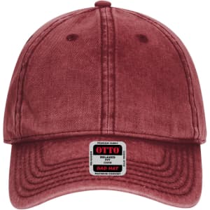 A burgundy six-panel low profile dad cap with a branded label on the front.
