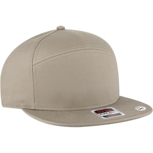 A beige 7 panel mid profile snapback cap with a flat brim and a logo on the side.