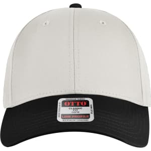 A low profile baseball cap in cream with a black peak and a logo on the front label.