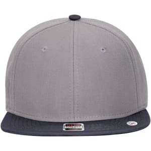 A grey snapback cap with a dark navy peak and a mid-profile design, featuring an interior logo.