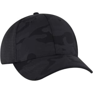 A black camo low profile trucker cap with a six-panel design and a mesh back, featuring a logo.