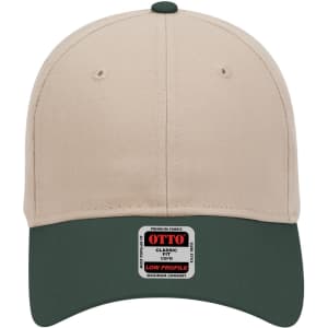 A low profile baseball cap in beige with a dark green peak, featuring a logo on the underside.
