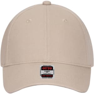 A beige low profile baseball cap for youth featuring an adjustable strap and a logo on the side.