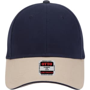 A low profile baseball cap featuring a navy blue crown and a beige brim, complete with a logo.