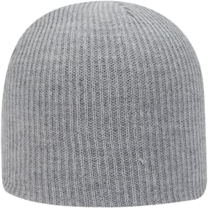 A grey rib knit beanie with a simple design and fitted structure. It features a logo on the exterior.
