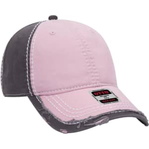 A pink and grey distressed 6-panel low profile dad cap with a logo on the front.