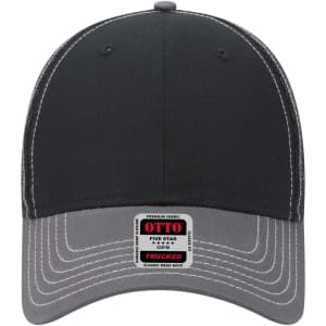 A black and grey 6 panel low profile trucker cap with a logo on the front and contrasting stitching.