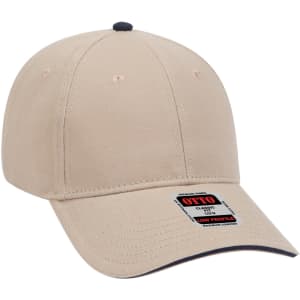 A beige six-panel low profile baseball cap with a contrasting navy underside and a logo.