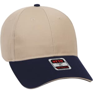A beige and navy 6 panel low profile baseball cap with a logo on the front.