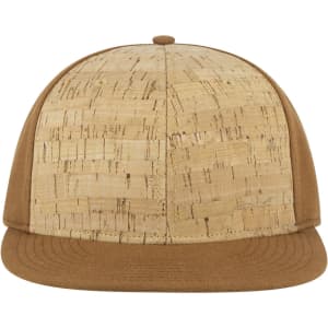 A tan snapback cap with a cork-textured front panel and a solid brown visor. It features a logo on the side.
