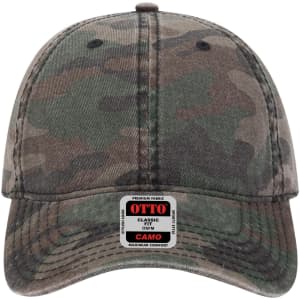 A camouflage-patterned, low-profile baseball cap in shades of green and brown, featuring a logo on the front.