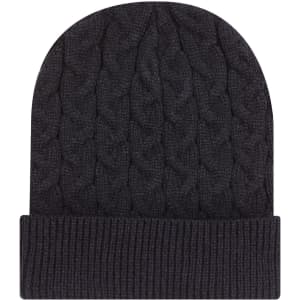 A dark grey cable knit beanie with a rib knit cuff, featuring a subtle branding logo.