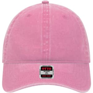 A pink 6-panel low profile dad cap featuring a branded tag on the front. The cap has a relaxed fit.