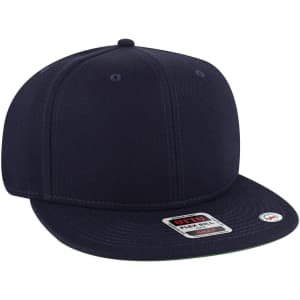 A snapback cap featuring a mid-profile design and a green undervisor, primarily in a navy colour.