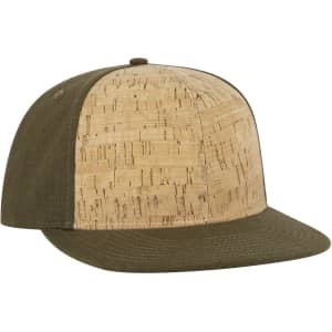 A cork and green fabric snapback cap featuring a mid-profile design and a flat brim. It includes a logo.