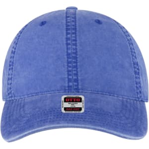 A blue six-panel low profile dad cap with a front branding patch and visible stitching detail.