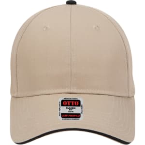 A beige 6 panel low profile baseball cap with a branding tag on the front and a black accent around the visor.